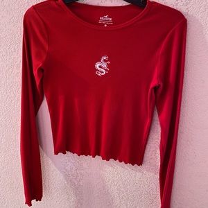 Must have tee collection. Not a a bright red. Took off the tag but never worn .